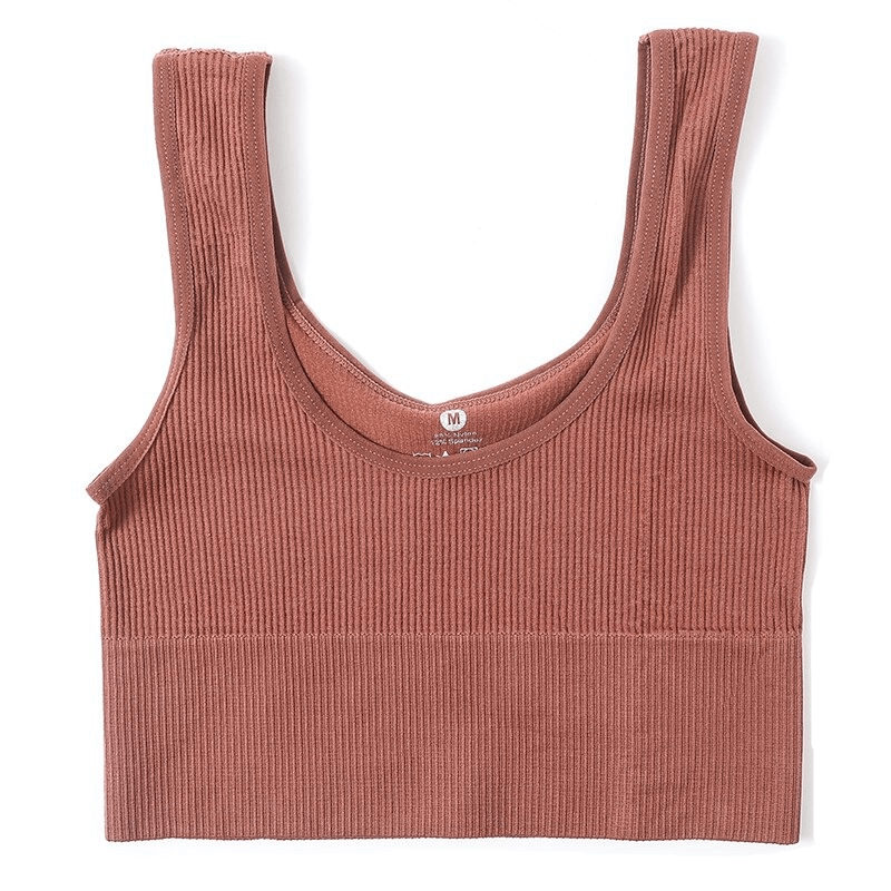 Ribbed seamless sports tank top in rust color, ideal for fitness, yoga, and running. Comfortable, breathable fabric for active women.